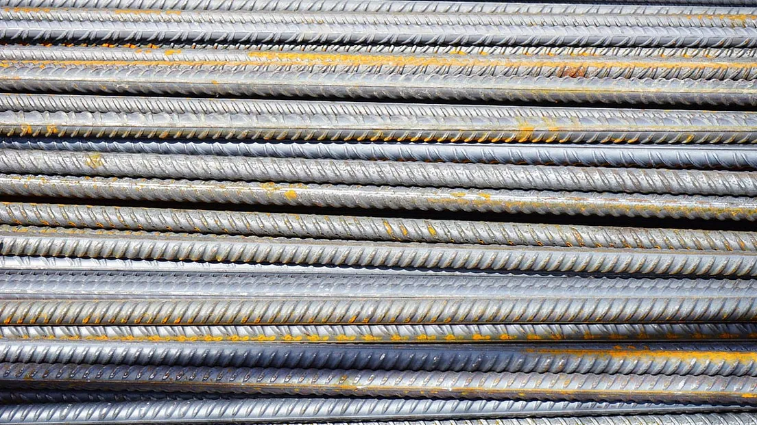 a pile scrap metal rods